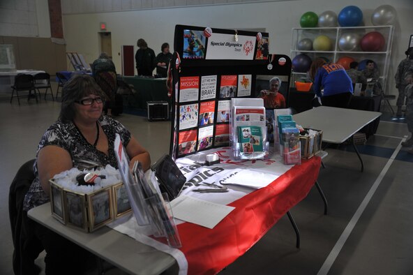 Luann Chastain, Special Olympics Area 14/Big Country area director, sits at her booth during the Volunteer Fair at the Carswell Field House on Goodfellow Air Force Base, Texas, Oct. 28, 2015. The booth helped raise awareness about Special Olympics activities. (U.S. Air Force photo by Airman Chase Sousa/Released)