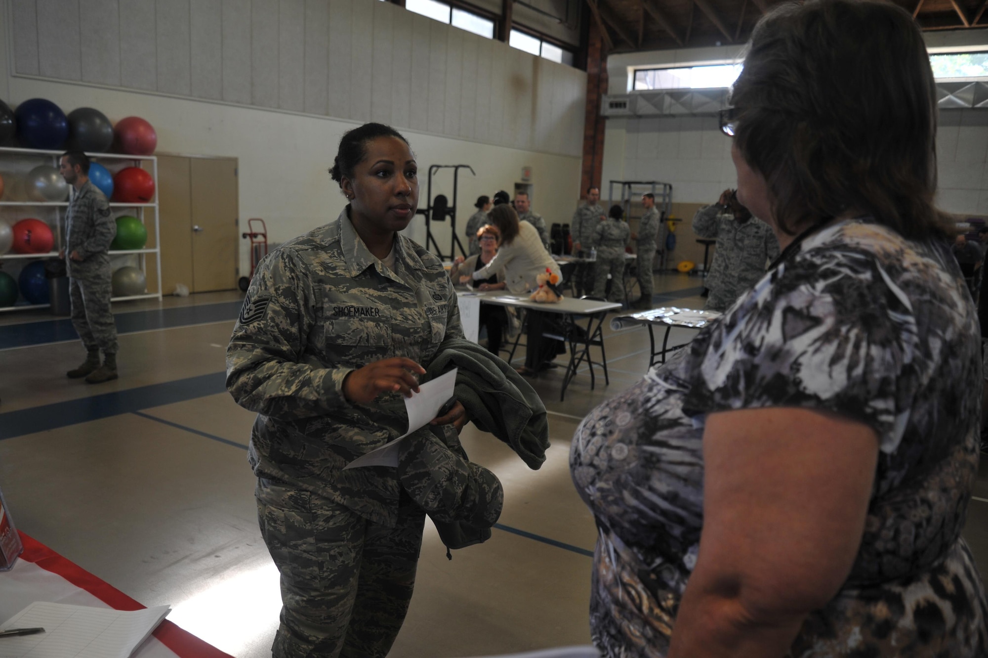 Luann Chastain, Special Olympics Area 14/Big Country area director, speaks to U.S. Air Force Tech. Sgt. Olivia K. Shoemaker, 316th Training Squadron instructor, about volunteer opportunities for the Special Olympics during the Volunteer Fair at the Carswell Field House on Goodfellow Air Force Base, Texas, Oct. 28, 2015. The Special Olympics Organization is an all-volunteer force. (U.S. Air Force photo by Airman Chase Sousa/Released)