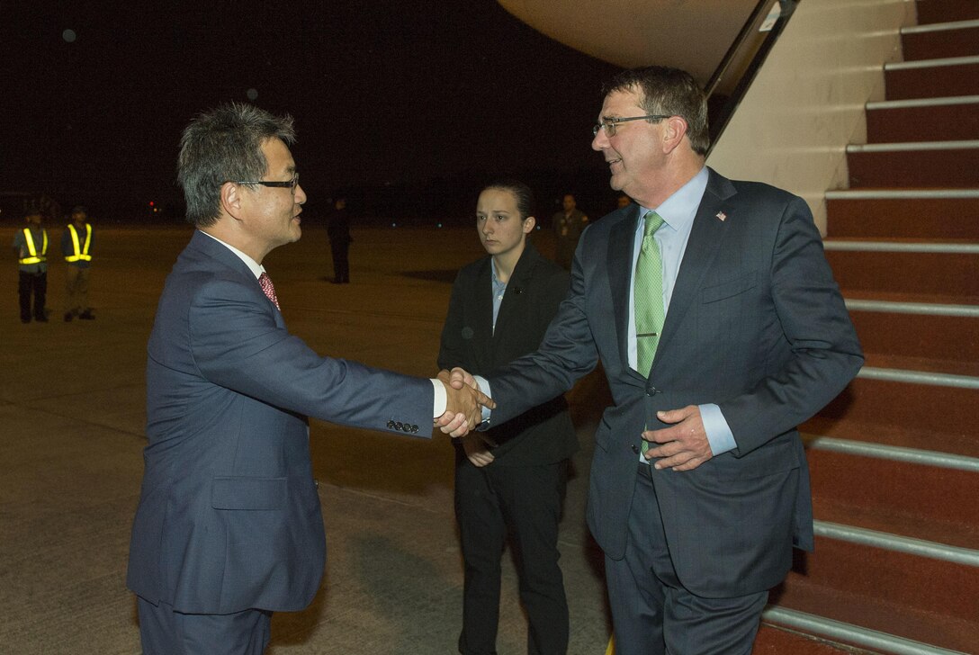 U.S. Ambassador to Malaysia Joseph Y. Yun, left, greets U.S. Defense Secretary Ash Carter upon Carter’s arrival in Kuala Lumpur, Malaysia, Nov. 2, 2015, to attend the Association of Southeast Asian Nations Defense Ministers’ Meeting – Plus. Carter is on an eight-day Asia-Pacific trip, his third trip to the region in eight months. DoD photo by Air Force Senior Master Sgt. Adrian Cadiz