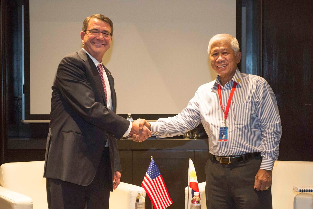 U.S. Defense Secretary Ash Carter poses for a photo with Philippine Secretary of National Defense Voltaire Gazmin as they meet to discuss matters of mutual interest during the Association of Southeast Asian Nations Defense Ministers' Meeting – Plus in Kuala Lumpur, Malaysia, Nov. 3, 2015. DoD photo by Air Force Senior Master Sgt. Adrian Cadiz