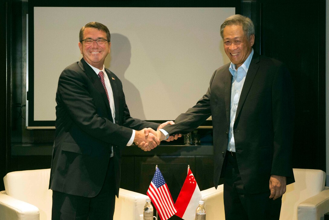 U.S. Defense Secretary Ash Carter exchanges greetings with Singapore Defense Minister Ng Eng Hen during the Association of Southeast Asian Nations Defense Ministers' Meeting – Plus in Kuala Lumpur, Malaysia, Nov. 3, 2015. DoD photo by Air Force Senior Master Sgt. Adrian Cadiz