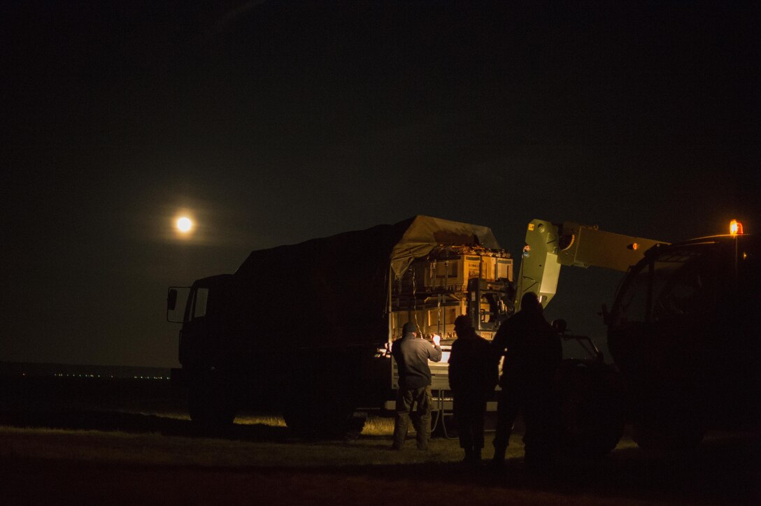 Polish airmen recover a bundle during Aviation Detachment 16-1 on Powidz Air Base, Poland, Oct. 27, 2015. U.S. Air Force photo by Senior Airman Damon Kasberg 