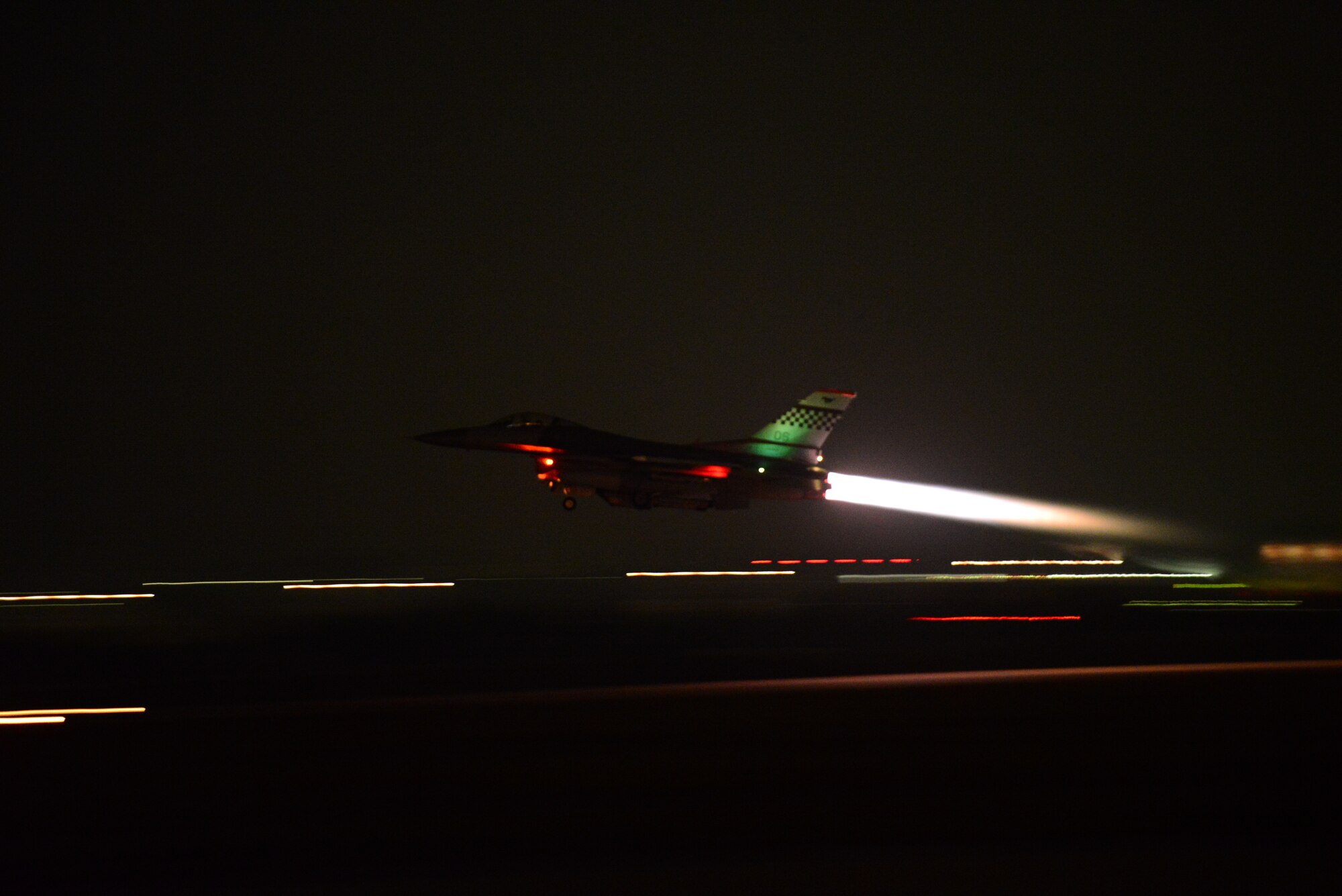 An F-16 Fighting Falcon screams down the runway spiting a trail of fire as it takes off for a night mission during Vigilant Ace 16 at Osan Air Base, Republic of Korea, Nov. 2, 2015. Vigilant Ace 16 is a peninsula-wide readiness exercise focused on strengthening the ROK and U.S. alliance. Supporting aircrews for the various aircraft participating in the exercise will have the opportunity to train alongside the many different crews from the ROK air force, as well as from forces across U.S. Pacific Command. (U.S. Air Force photo/Staff Sgt. Amber Grimm)