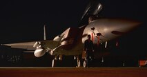 Senior Airman Dennis Franco, 67th Fighter Squadron Aircraft Maintenance Unit crew chief, performs a final check on an F-15 Eagle before turning it over to the next shift at Gwangju Air Base, Republic of Korea, Nov. 2, 2015. Airmen work around the clock to ensure the jets are ready to deploy at a moment’s notice to maintain combat readiness. (U.S. Air Force photo/Senior Airman Omari Bernard)