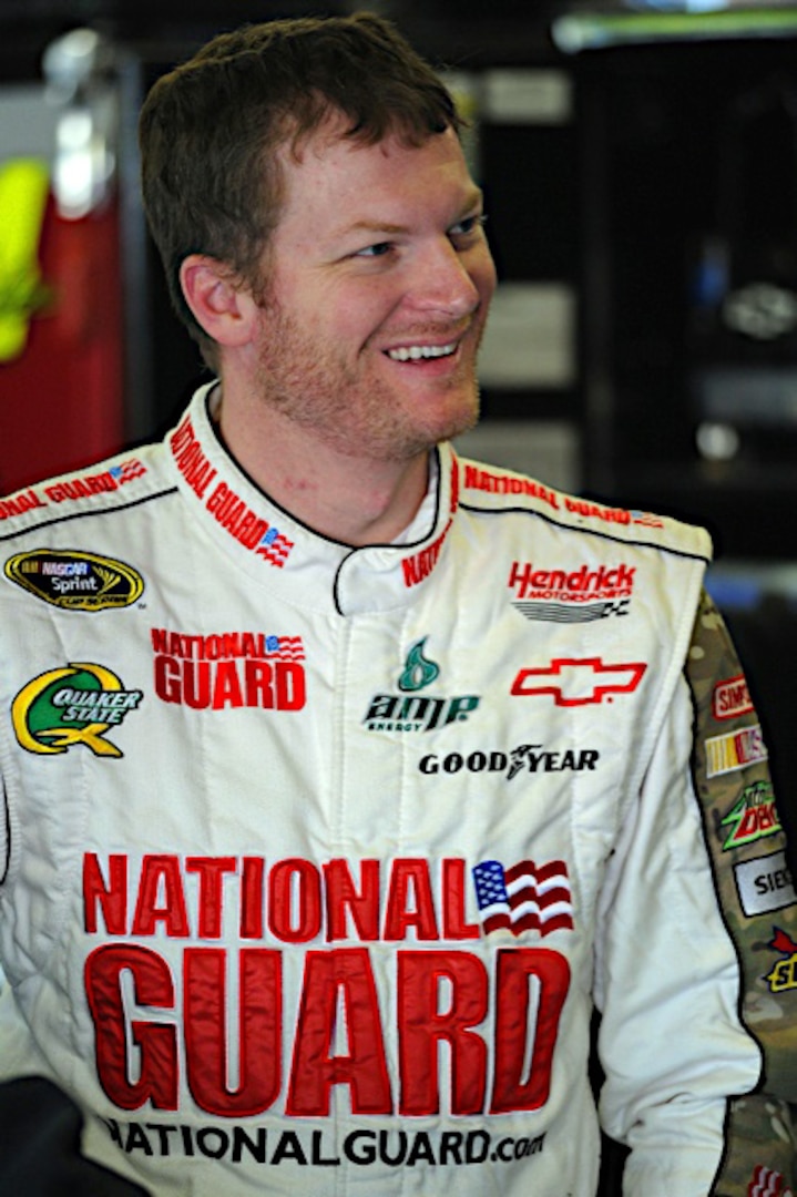 Dale Earnhardt Jr., driver of the No. 88 National Guard NASCAR racecar, smiles after finishing in seventh place at Texas Motor Speedway in Fort Worth, Texas Nov. 6, 2011.