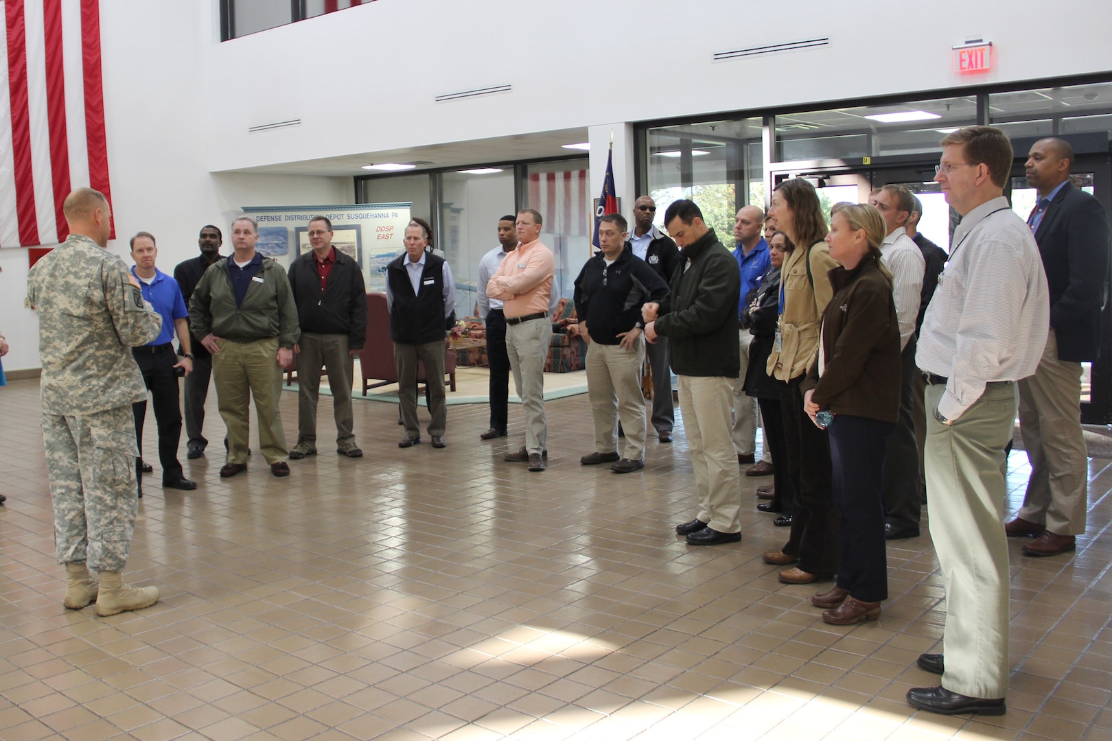 Army Col. Corey New, DLA Distribution susquehanna, Pa., commander, describes the organization's mission prior to the Eisenhower School's tour of the distribution center's Eastern Distribution Center.