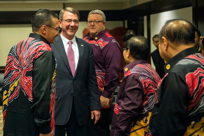 Secretary of Defense Ash Carter speaks with several defense officials during a reception at the Association of Southeast Asian Nations Defense Ministers Meeting Plus in Kuala Lumpur, Malaysia Nov. 3, 2015. 