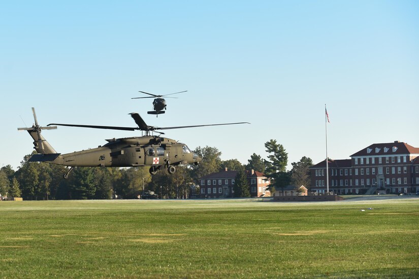 A HH-60 medevac helicopter from Fox Company 1-214th Aviation Regiment and a UH-60 Black Hawk helicopter from 8-229th Assault Helicopter Battalion come to a hover Oct. 18 at Brooks Field, Fort Knox, Ky. These aircraft were being prepositioned as a static display for the 11th Theater Aviation Command’s Change of Responsibility Ceremony. Command Sgt. Maj. James Peter Matthews took the helm as the senior enlisted soldier from Command Sgt. Maj. Steven Hatchell. The 11th Theater Aviation Command (TAC) is the only aviation command in the Army Reserve. The 11th TAC has two missions, functioning as both a warfighting headquarters and as a functional command. As warfighting command, the 11th TAC provides command & control, staff planning, and supervision for two aviation brigades and one air traffic service battalion. As a functional command the 11th TAC provides command and control for all Army Reserve Aviation. (Photos by Renee Rhodes / Fort Knox Visual Information)