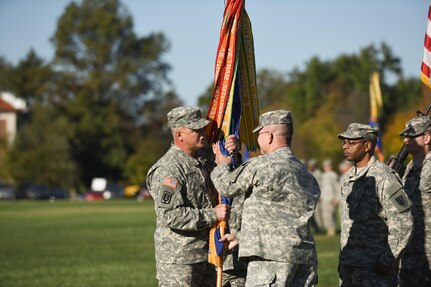 Outgoing command sergeant major, Command Sgt. Maj. Steven Hatchell, passes the command’s colors to Brig. Gen. Scott Morcomb in his last official act as the 11th Theater Aviation Command’s command sergeant major during the Change of Responsibility Ceremony held at Fort Knox, Ky., Oct. 18. Command Sgt. Maj. James Peter Matthews took the helm as the senior enlisted soldier from Command Sgt. Maj. Steven Hatchell. The 11th Theater Aviation Command (TAC) is the only aviation command in the Army Reserve. The 11th TAC has two missions, functioning as both a warfighting headquarters and as a functional command. As warfighting command, the 11th TAC provides command & control, staff planning, and supervision for two aviation brigades and one air traffic service battalion. As a functional command the 11th TAC provides command and control for all Army Reserve Aviation. (Photo by Renee Rhodes / Fort Knox Visual Information)