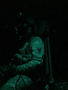 Staff Sgt. Bradley Johnson, from Bravo Company, 8-229th Assault Helicopter Battalion is ready for night aerial gunnery in a UH-60L Black Hawk Helicopter at Yano Range, Fort Knox Ky.