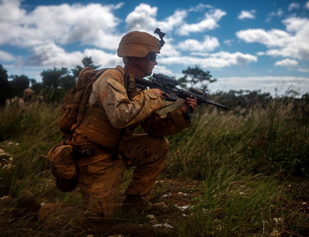 Cpl. Benjamin B. Bacon provides security after exiting a CH-53E Super Stallion helicopter during the Air Naval Gunfire Liaison Company Basic Course, on Camp Hansen, Okinawa, Japan, Oct. 24. The course included the loading and unloading of helicopters, setting security, coordinating artillery fire, naval gunfire and close air support. Bacon, from Lubbock, Texas, is a fire support man with 1st Brigade, 5th ANGLICO, III Marine Expeditionary Force Headquarters Group, III MEF.