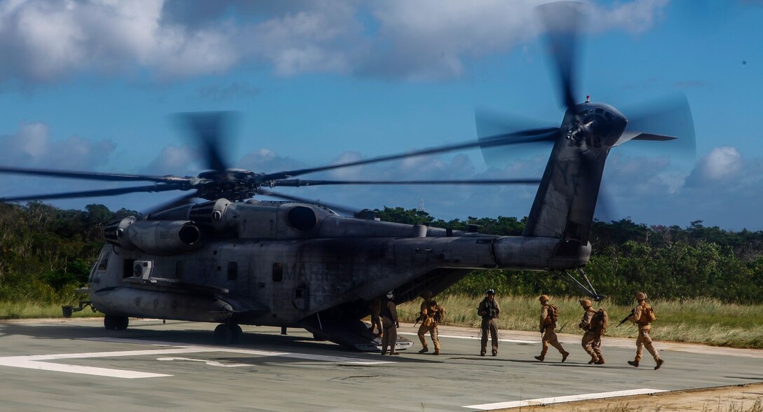 Marines with 5th Air Naval Gunfire Liaison Company practice boarding a CH-53E Super Stallion helicopter on Camp Hansen, Okinawa, Japan, Oct. 24. The Marines participated in the ANGLICO basic course, which, included the loading and unloading of helicopters, setting-up perimeter security, coordinating artillery fire, naval gunfire and close air support. The Marines are with 5th ANGLICO is with, III Marine Expeditionary Force Headquarters Group, III MEF.