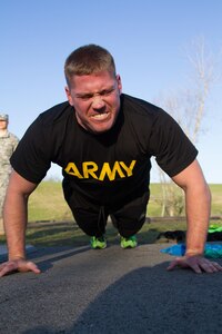 Staff Sgt. Andrew Fink, 409th Area Support Medical Company,  307th Medical Brigade, 807th Medical Command and a native of Cook, Minn., completes one of his many push-ups during the army physical fitness test for the 807th Medical Command's Best Warrior Competition at Wendell H. Ford Training Center near Greenville, Ky. March 23. Fink won the 807th Medical Command Best Warrior noncommissioned officer category.  He'll compete at the US Army Reserve Best Warrior competition this May.  (US Army Photo by Sgt. 1st Class Adam Stone)