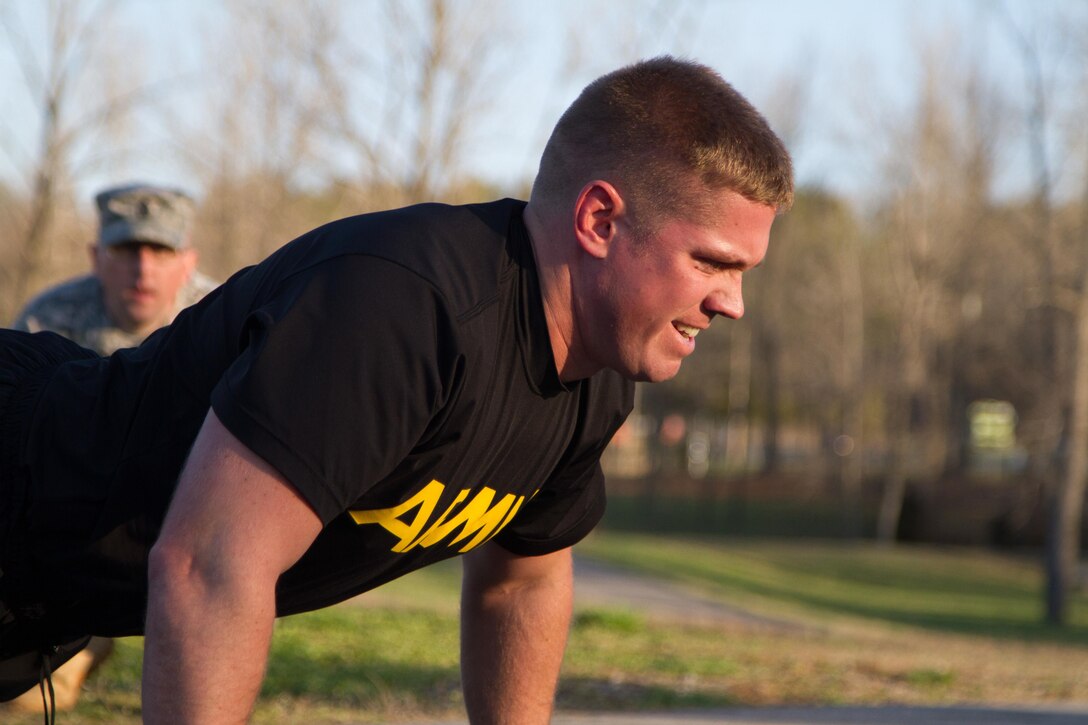 Staff Sgt. Andrew Fink, 409th Area Support Medical Company,  307th Medical Brigade, 807th Medical Command and a native of Cook, Minn., completes one of his many push-ups during the army physical fitness test for the 807th Medical Command's Best Warrior Competition at Wendell H. Ford Training Center near Greenville, Ky. March 23. Fink won the 807th Medical Command Best Warrior noncommissioned officer category.  He'll compete at the US Army Reserve Best Warrior competition this May.  (US Army Photo by Sgt. 1st Class Adam Stone)