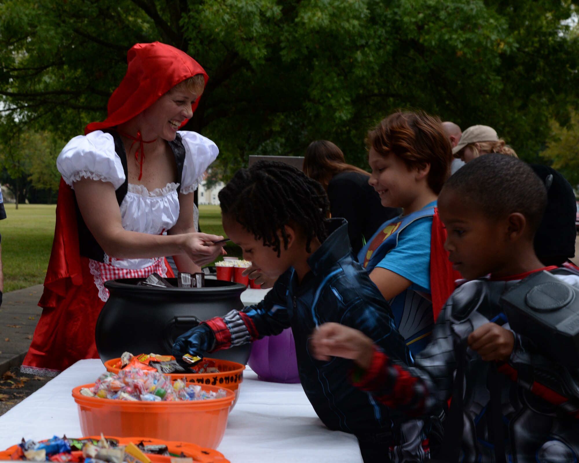 Col. Kristen Goodwin, 2nd Bomb Wing commander, hands out candy during Operation Pumpkin Party at Barksdale Air Force Base, La., Oct. 31, 2015. Goodwin hosted the event where children enjoyed hot dogs, candy and popcorn. (U.S. Air Force photo/ Senior Airman Jannelle Dickey)