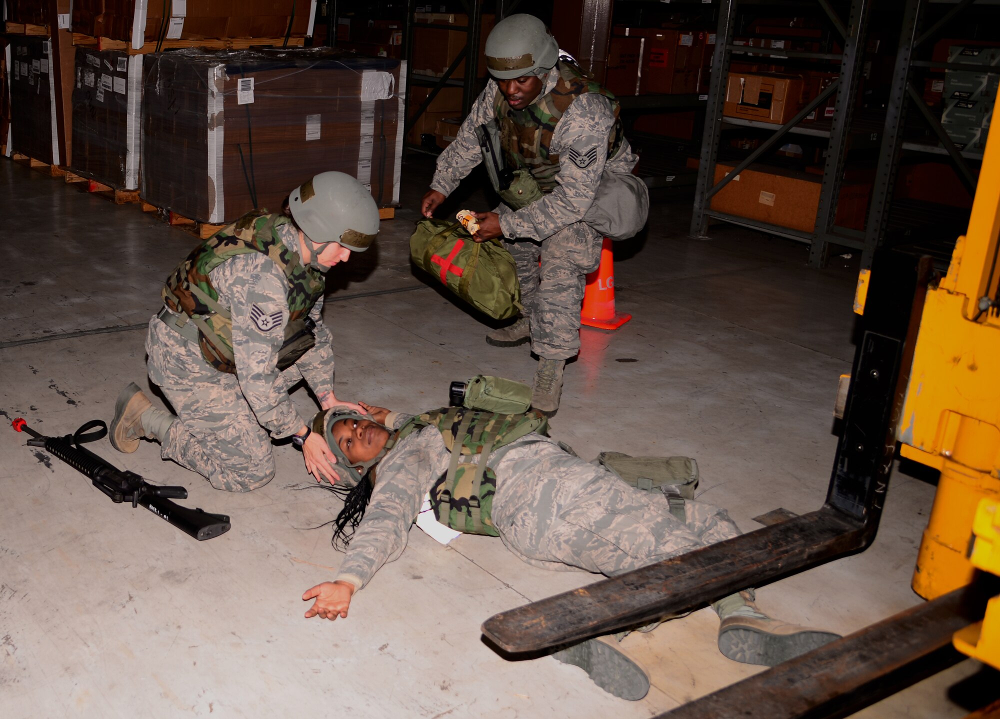 Members of the 51st Logistics Readiness Squadron materials management flight arrive on the scene of a simulated medical emergency Nov. 2, 2015, at Osan Air Base, Republic of Korea. Members of Team Osan are participating in the readiness exercise Vigilant Ace 16 which is a peninsula-wide exercise focusing on enhancing the readiness of U.S. forces. (U.S. Air Force photo/Staff Sgt. Benjamin Sutton)