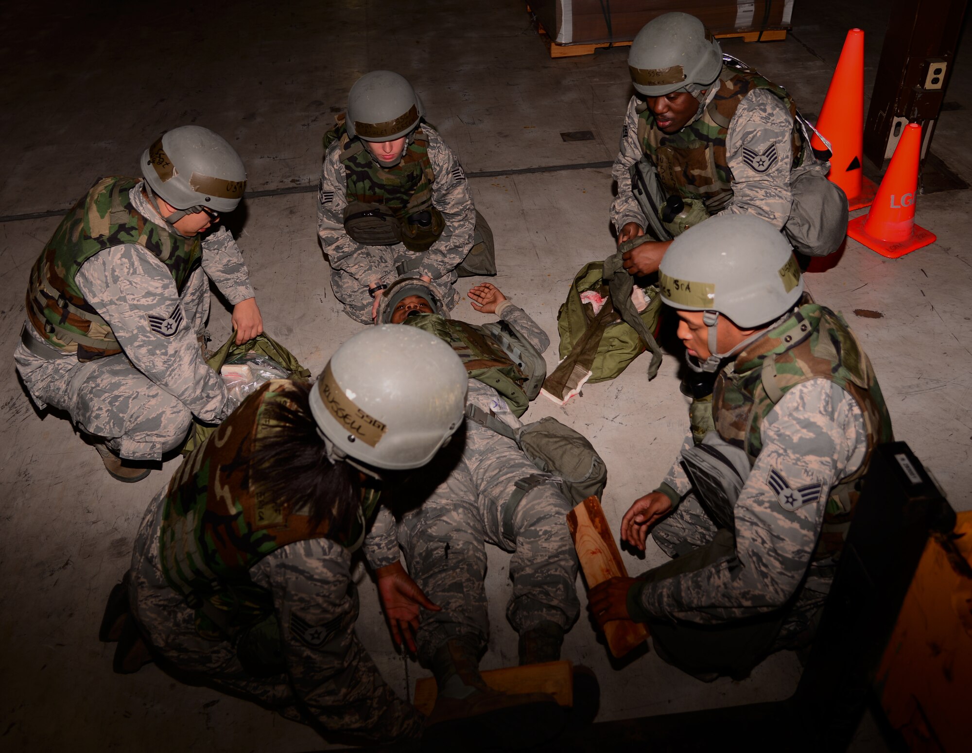 Team Osan members assigned to the 51st Logistics Readiness Squadron materials management flight perform Self-Aid Buddy Care on a simulated victim Nov. 2, 2015, at Osan Air Base, Republic of Korea. These Airmen are just a small part of the 16,000 participants of the readiness exercise Vigilant Ace 16, which focuses on enhancing the readiness and interoperability of U.S. and ROK forces. (U.S. Air Force photo/Staff Sgt. Benjamin Sutton)