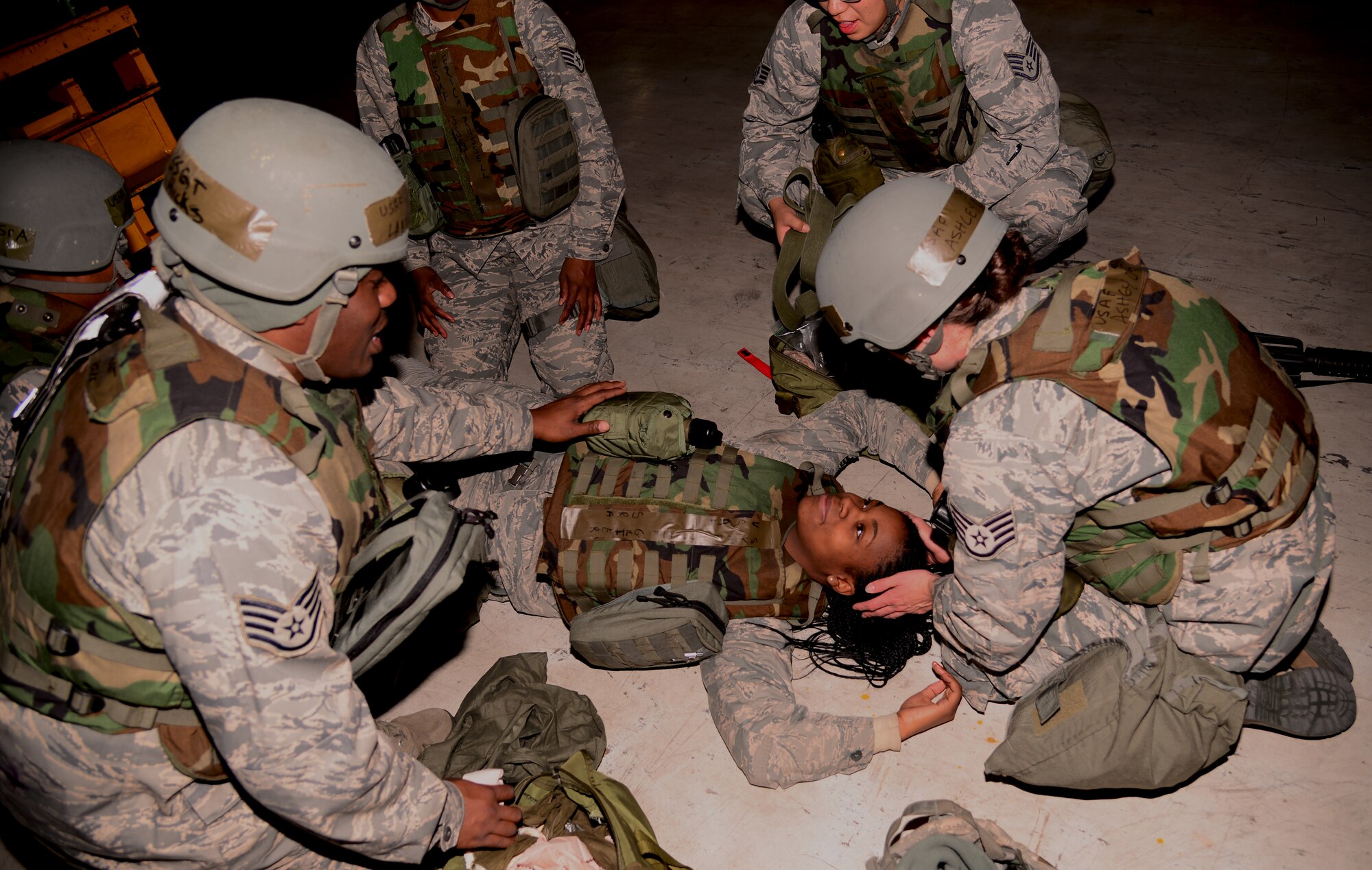 Members from the 51st Logistics Readiness Squadron perform Self-Aid Buddy Care on a simulated victim  Nov. 2, 2015, at Osan Air Base, Republic of Korea. The 51st Fighter Wing is participating in the readiness exercise Vigilant Ace 16, which focuses on enhancing the readiness and interoperability of U.S. and ROK forces. (U.S. Air Force photo/Staff Sgt. Benjamin Sutton)