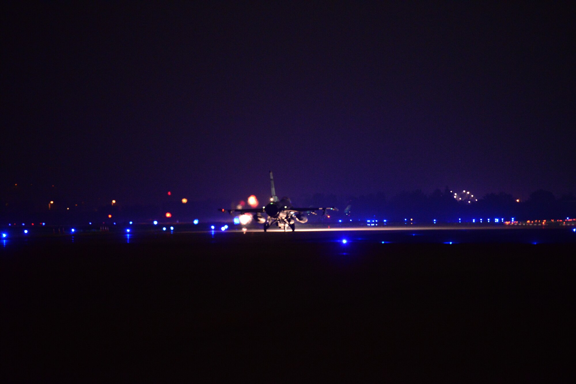 An F-16 Fighting Falcon taxis down the runway of Osan Air Base, Republic of Korea, Nov. 2, 2015. Night operations are being run during Vigilant Ace 16, a peninsula-wide readiness exercise focused on strengthening the ROK and U.S. alliance. (U.S. Air Force photo/Staff Sgt. Amber Grimm)