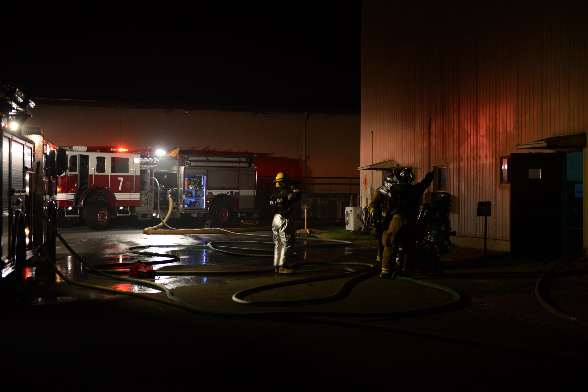 Firefighters from the 51st Civil Engineer Squadron respond to a simulated building fire during Vigilant Ace 16 at Osan Air Base, Republic of Korea, Nov. 3, 2015. The exercise is focused on linking U.S. and Korean operational planners with tactical-level operations to enhance the quality of exercises and ensure readiness for future operations.  (U.S. Air Force photo/Staff Sgt. Amber Grimm)