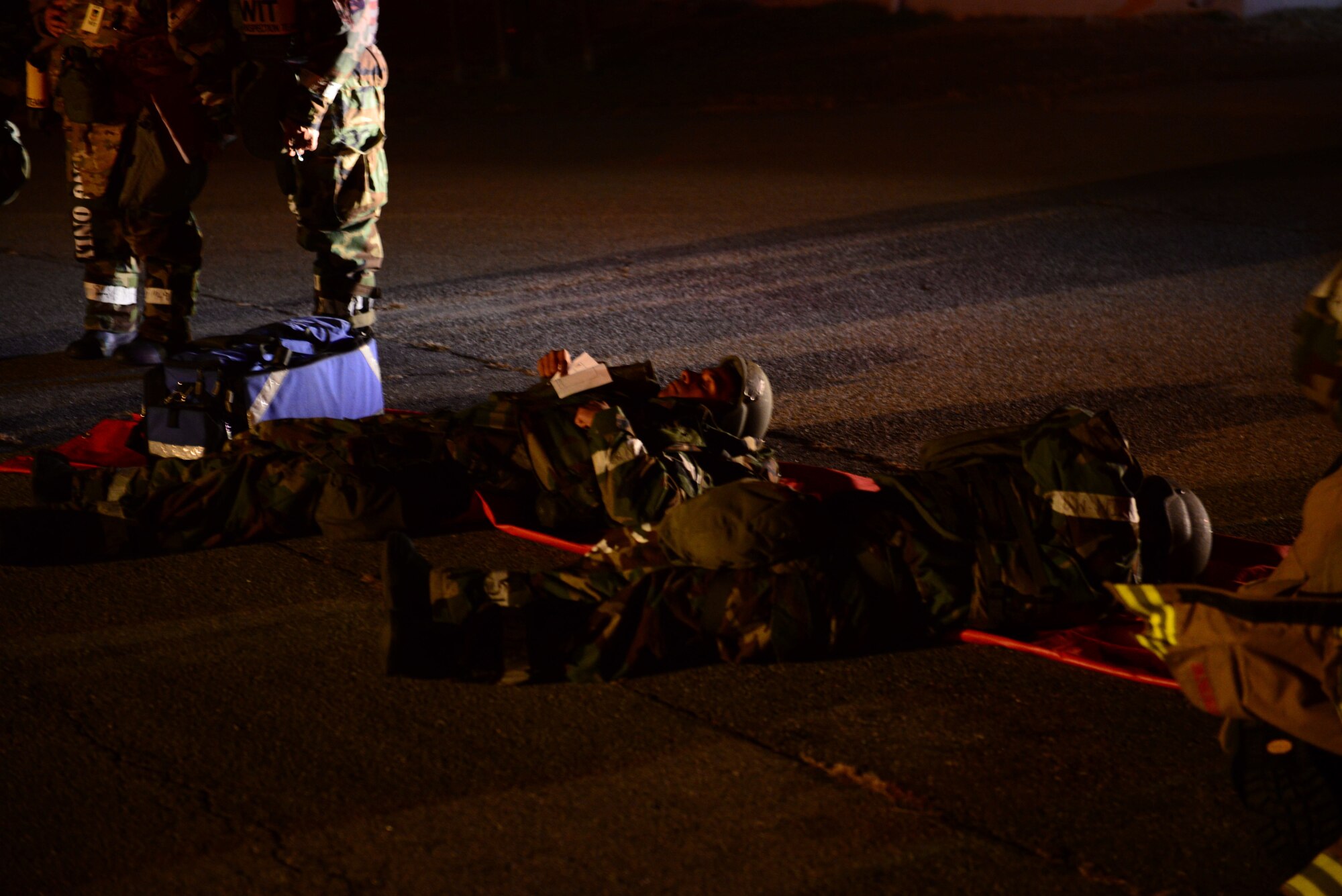 Simulated casualties lay out after being rescued from a mock building fire by 51st Civil Engineer Squadron firefighters during Vigilant Ace 16 at Osan Air Base, Republic of Korea, Nov. 3, 2015. Roughly 16,000 U.S. personnel will participate in the annual peninsula-wide exercise taking place at eight different air bases across the ROK. (U.S. Air Force photo/Staff Sgt. Amber Grimm)