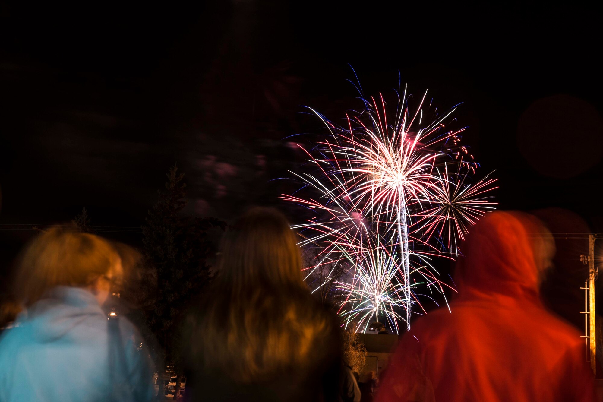 Icemen and their families watch fireworks during the Fall Festival on Oct. 28, 2015, at Eielson Air Force Base, Alaska. The 354th Force Support Squadron puts on a 4th of July-scale fireworks show during the fall because the summer months have such extended hours of sunlight. (U.S. Air Force photo by Staff Sgt. Joshua Turner/Released)
