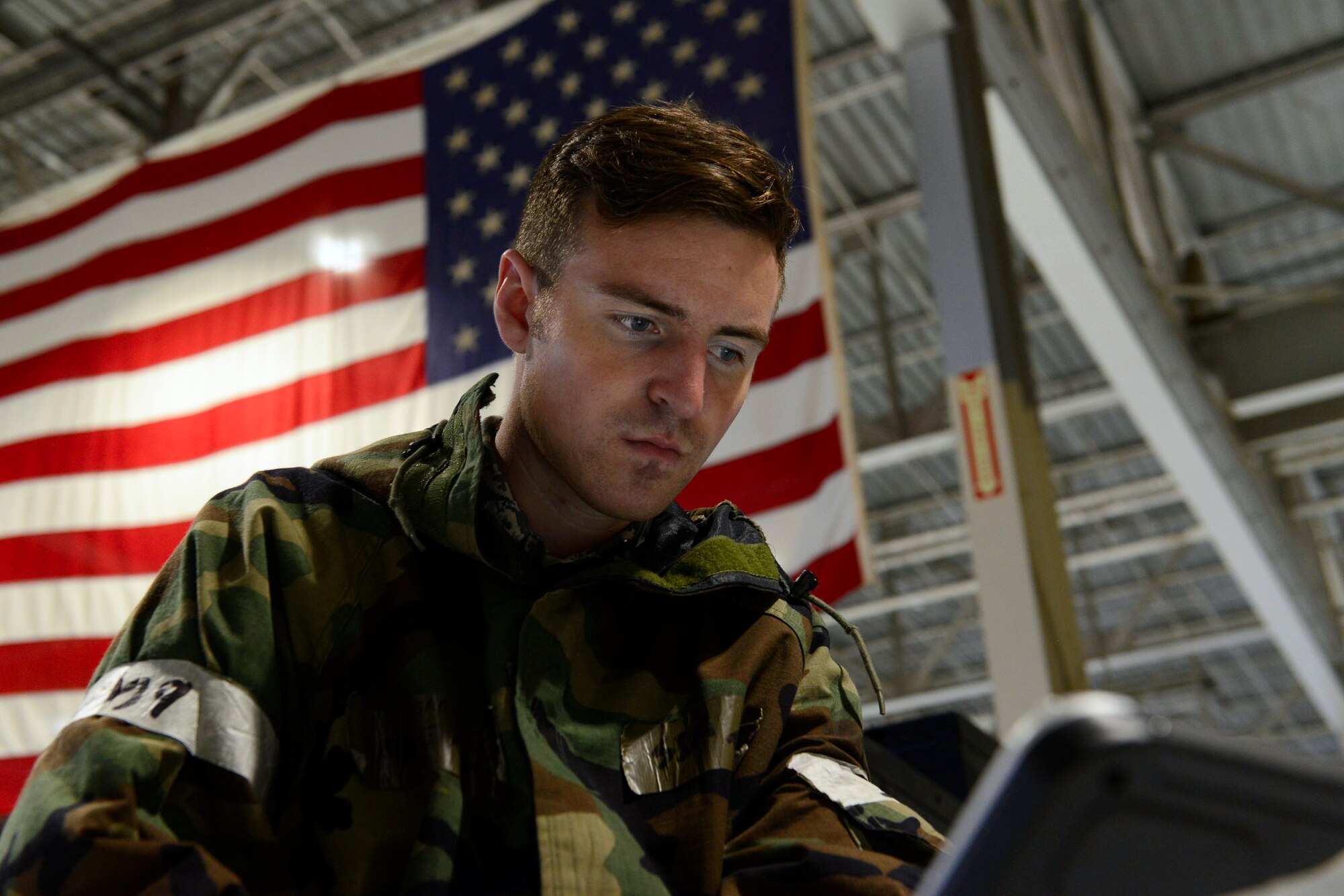 U.S. Air Force Senior Airman Jerrod Adams, 20th Component Maintenance Squadron test cell facility journeyman, looks over a technical order while performing maintenance on an F-16CM Fighting Falcon engine during operational readiness exercise Weasel Victory 16-02 at Shaw Air Force Base, S.C., Nov. 3, 2015. The exercise ensures Airmen of the 20th Fighter Wing are trained and prepared to support overseas contingency operations. (U.S. Air Force photo by Airman 1st Class Christopher Maldonado/Released)  