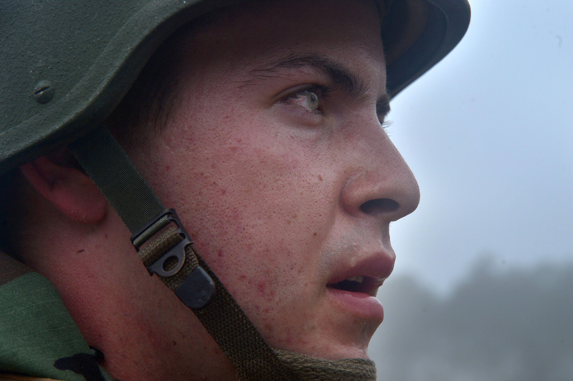 A U.S. Air Force Airman assigned to the 20th Civil Engineer Squadron watches on during training at the fire department training grounds during operational readiness exercise Weasel Victory 16-02 at Shaw Air Force Base, S.C., Nov. 2, 2015. Throughout the ORE, Airmen were evaluated on various tasks to test their combat capabilites. (U.S. Air Force photo by Senior Airman Michael Cossaboom/Released)