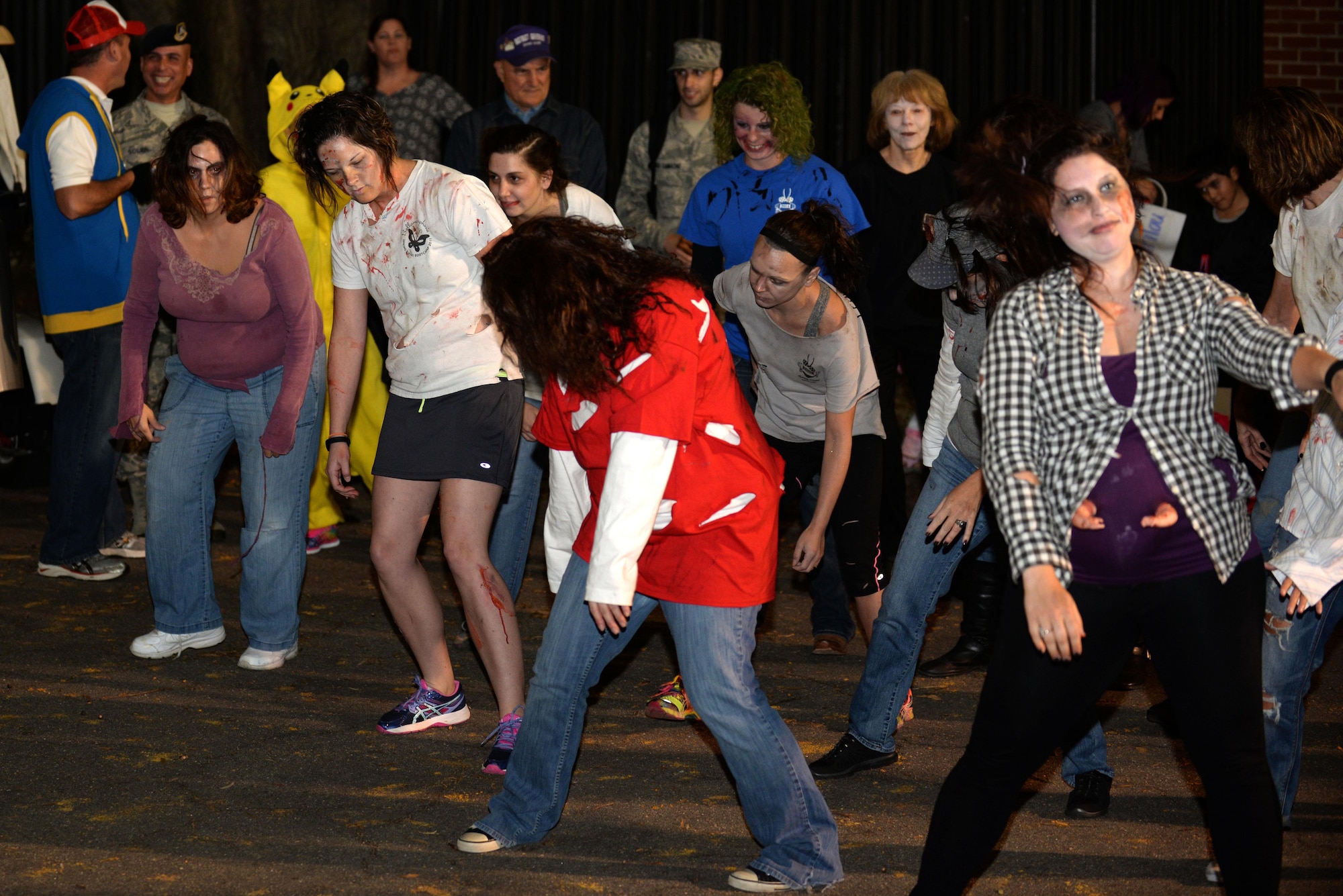 Team Seymour members dance in a flash mob to Michael Jackson’s “Thriller” during the Halloween block party, Oct. 30, 2015, at Seymour Johnson Air Force Base, North Carolina. BellaMorphosis members planned the flash mob for the enjoyment of the attendees at the block party. (U.S. Air Force photo/Airman 1st Class Ashley Williamson)