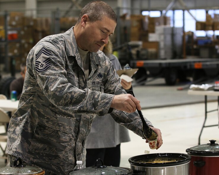 WRIGHT-PATTERSON AIR FORCE BASE, Ohio - Chief Master Sgt. Sean Storms, 87th Aerial Port Squadron, air transportation superintendent, ponders a sample of chili for taste and texture while judging the 445th Airlift Wing’s 15th Annual Chili Cook-off Oct. 29, 2015. The event raised more than $350 for the Combined Federal Campaign. (U.S. Air Force photo/Tech. Sgt. Patrick O’Reilly)