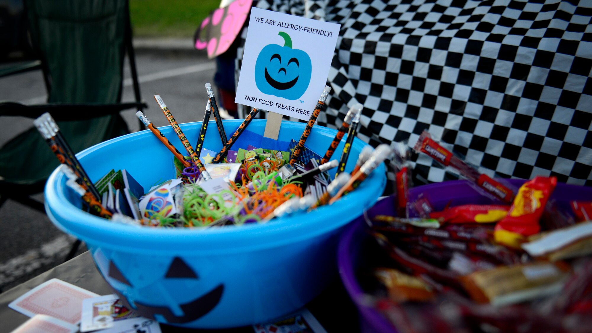 Bowls of candy and goodies wait to be claimed by trunk-or-treaters during Trunk-or-Treat, Oct. 31, 2015, at Aviano Air Base, Italy. During the event young Wyvern Warriors trick-or-treated from parked car to parked car as an alternative to going from house-to-house. (U.S. Air Force photo by Senior Airman Areca T. Bell/Released)
