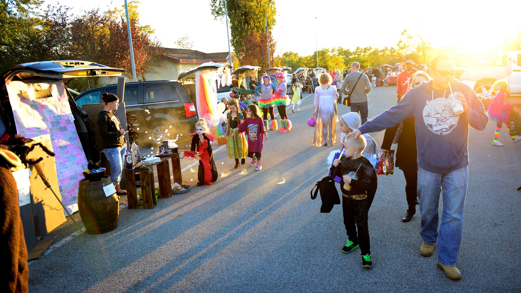 Team Aviano members enjoy Trunk-or-Treat, Oct. 31, 2015, at Aviano Air Base, Italy. To celebrate Halloween, Aviano members decorated their vehicles for the trunk-or-treaters to enjoy. (U.S. Air Force photo by Senior Airman Areca T. Bell/Released)