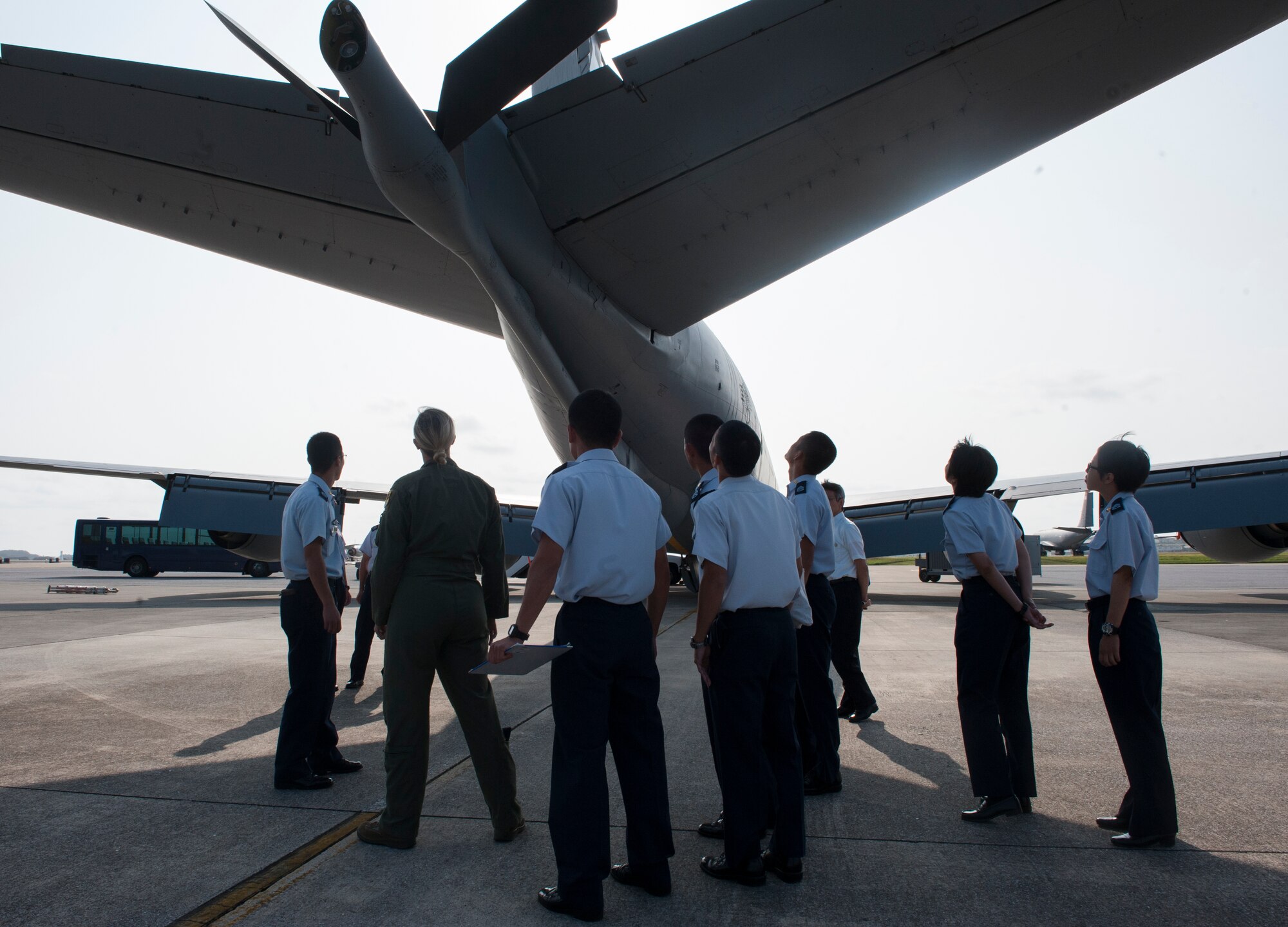 U.S. Air Force 1st Lt. Morgan Bielecki, 909th Air Refueling Squadron pilot, shows Japan Air Self-Defense Force members the boom of a KC-135 Stratotanker during a tour Oct. 29, 2015, at Kadena Air Base, Japan. More than 60 JASDF members toured the 909th ARS and Kadena to get a better understanding of the mission and to promote bilateral ties. (U.S. Air Force photo by Airman 1st Class Corey M. Pettis)