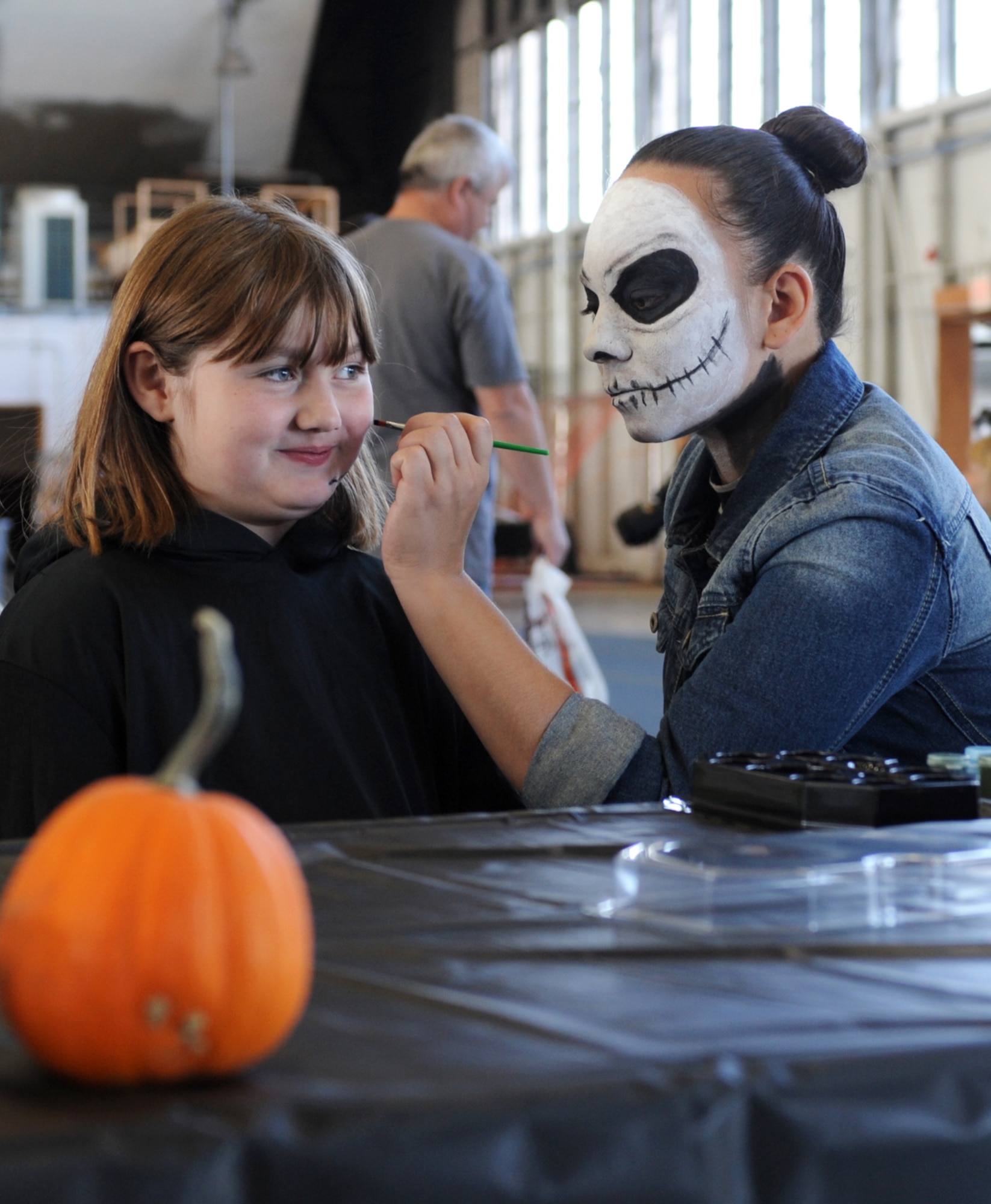 A child has her face painted during the 28th Bomb Wing Children’s Halloween Festival at Ellsworth Air Force Base, S.D., Oct. 24, 2015. More than 700 base residents attended the annual event which was set up and organized by more than 40 volunteers from across the base. (U.S. Air Force photo by Airman 1st Class Denise M. Nevins/Released)