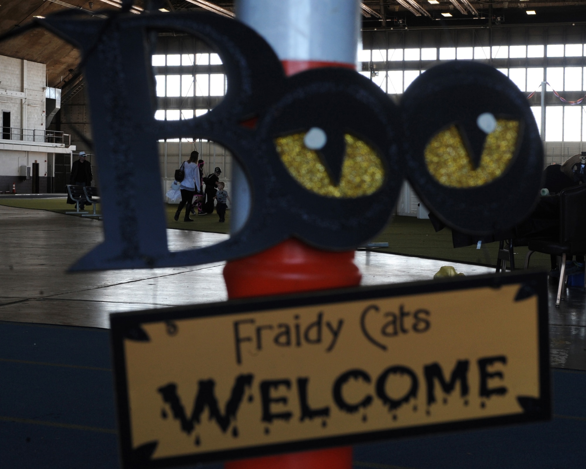 Families and children from Team Ellsworth gather in the Pride Hangar for the 28th Bomb Wing Children’s Halloween Festival at Ellsworth Air Force Base, S.D., Oct. 24, 2015. The event included a party inflatable, games, crafts and a haunted house. (U.S. Air Force photo by Airman 1st Class Denise M. Nevins/Released)