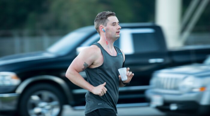 Senior Airman James Hauck, 628th Comptroller Squadron budget analyst, runs the annual Zombie 5K at Joint Base Charleston – Air Base, S.C., on Oct. 30, 2015. The runners were given snacks and water to help them recover at the end of the 5K. (U.S. Air Force photo/Airman 1st Class Thomas Charlton)