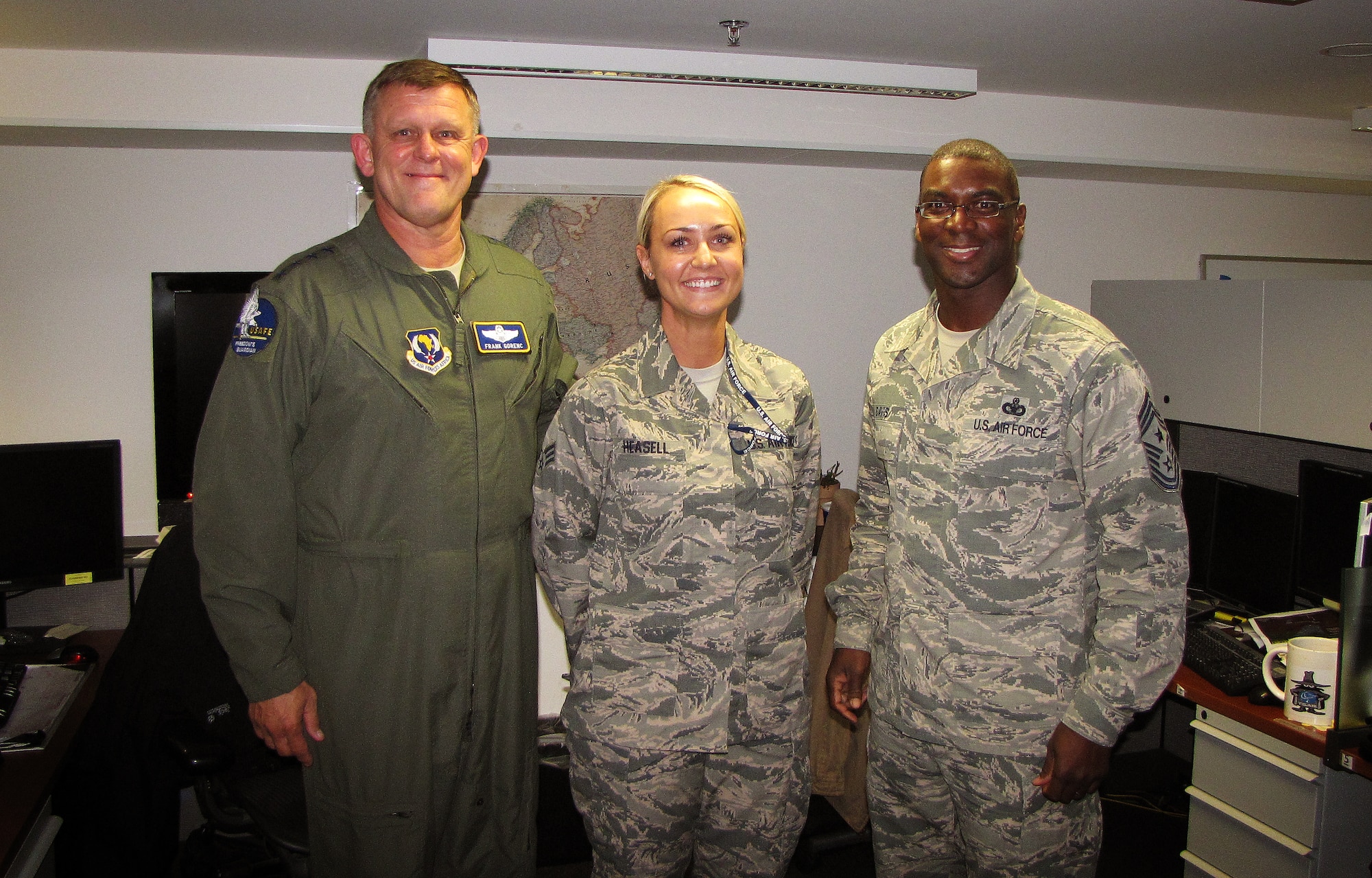 Gen. Frank Gorenc and Chief Master Sgt. James Davis, U.S. Air Forces in Europe and Air Forces Africa command team, congratulate Senior Airman Shabree Heasell, USAFE-AFAFRICA imagery analyst, on her selection for the Senior Leader Enlisted Commissioning Program Sept. 29, 2015 at Ramstein Air Base, Germany. Senior Airman Shabree Heasell was one of only 10 chosen across the Air Force for this brand new program. Each major command commander was given the opportunity to select just one enlisted Airman from their command to attend officer training school. (Courtesy photo)