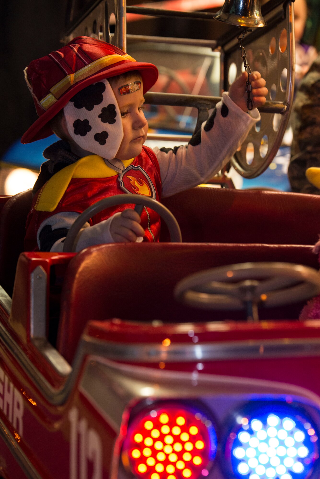 Wyatt White, son of U.S. Air Force Tech. Sgt. Oryan White, 52nd Aircraft Maintenance Squadron flightline expediter and Laurie White, rides on a children’s carousal during Family Fright Night at the Club Eifel parking lot on Spangdahlem Air Base, Germany, Oct. 30, 2015. The 52nd Force Support Squadron hosted a Halloween block party for the community at no cost. (U.S. Air Force photo by Staff Sgt. Christopher Ruano/Released)