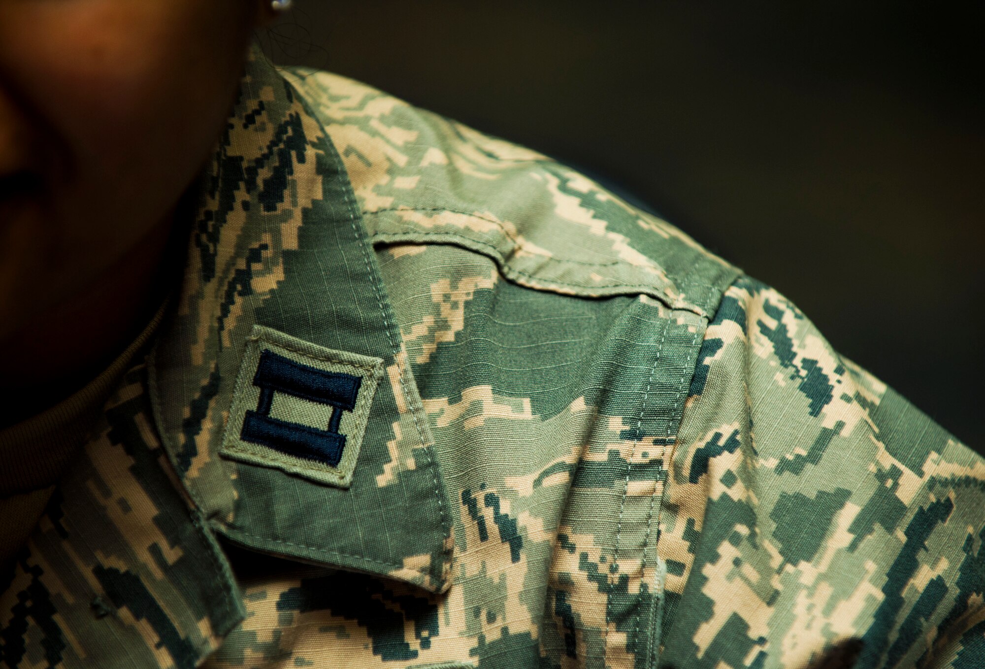 U.S. Air Force Capt. Annabelle Hill, 52nd Fighter Wing command executive, sits with her rank insignia displayed during a speed mentoring session inside Club Eifel at Spangdahlem Air Base, Germany, Oct. 29, 2015. Speed mentoring sessions serve as a means to keep an open communication between the company grade officer and senior NCO board, allowing Airmen to mentor one another, regardless of rank. (U.S. Air Force photo by Airman 1st Class Timothy Kim/Released)