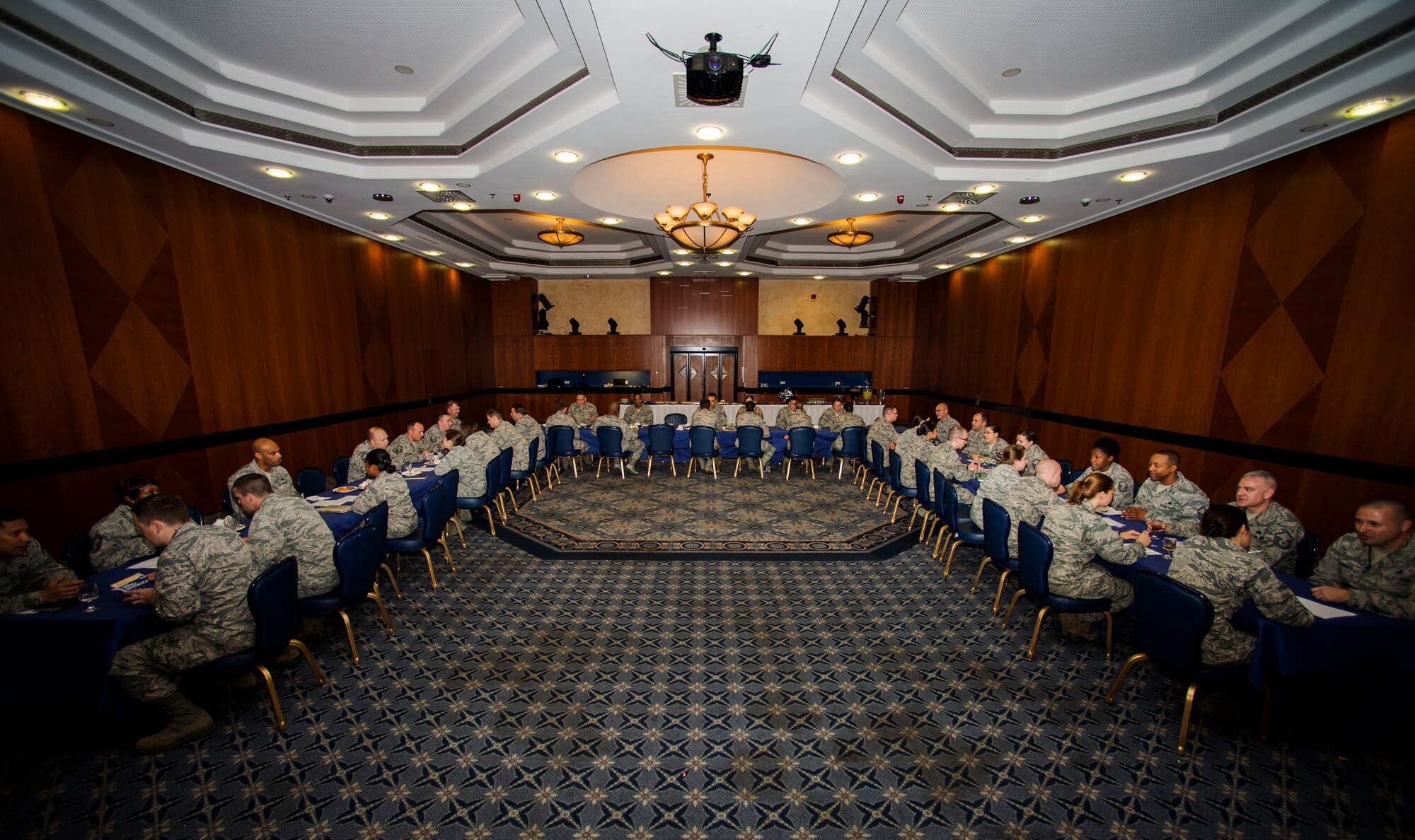Twenty-five company grade officers and 25 senior NCOs participate in a speed mentoring session inside Club Eifel at Spangdahlem Air Base, Germany, Oct. 29, 2015. With the motto of “Building Solid Relationships to Build Solid Teams” in mind, the CGOs and SNCOs exchanged ideas and techniques on leadership and professional growth. (U.S. Air Force photo by Airman 1st Class Timothy Kim/Released)