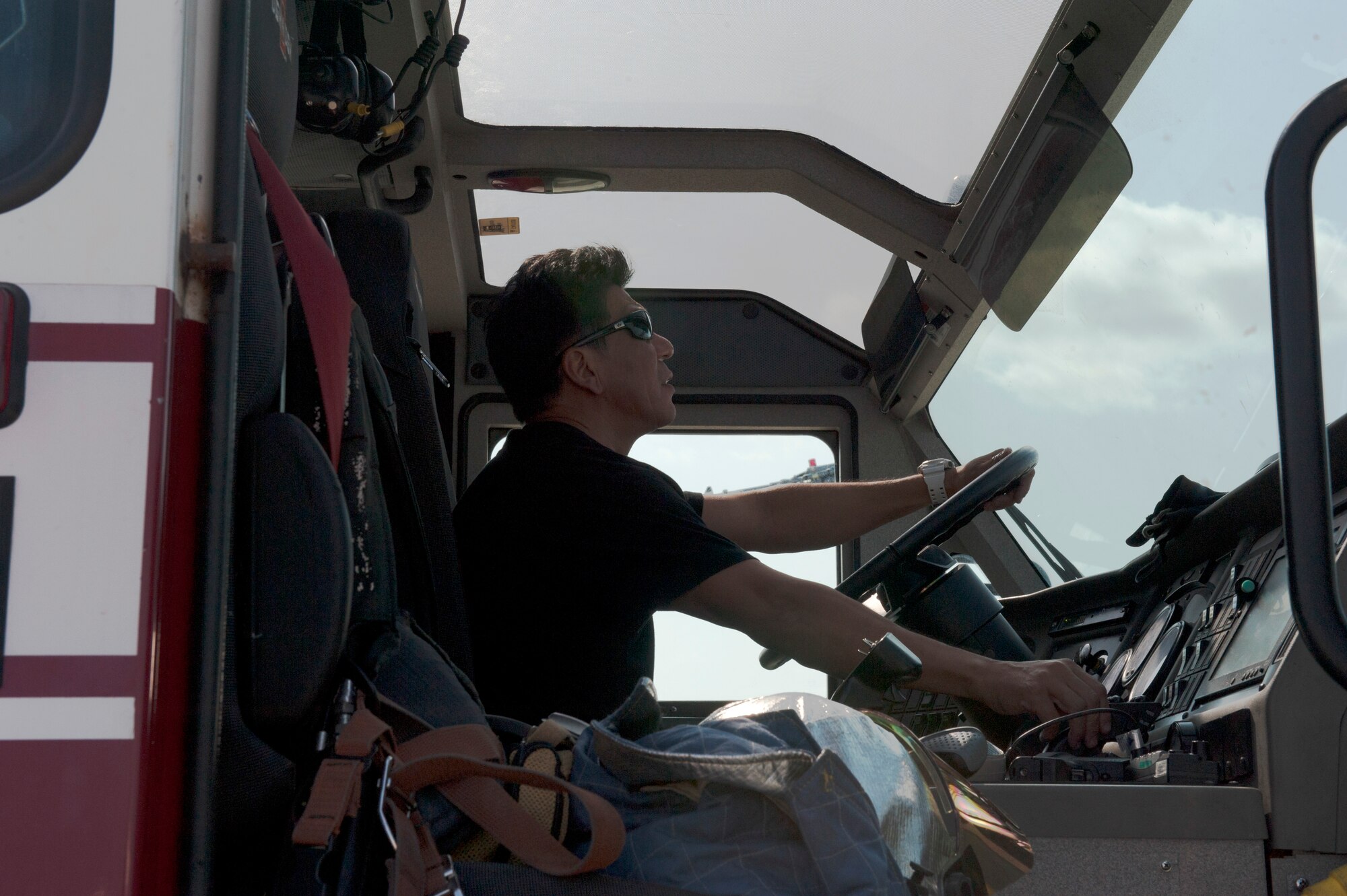 Yutaka Higa, 18th Civil Engineer Squadron firefighter, operates a pierce tool during a bilateral aircraft egress training event Oct. 29, 2015, at Kadena Air Base, Japan. Local Okinawan emergency responders were shown the different vehicles and tools that are used by U.S. Air Force emergency personnel during the event of an aircraft mishap. (U.S. Air Force photo by Airman 1st Class Lynette M. Rolen)