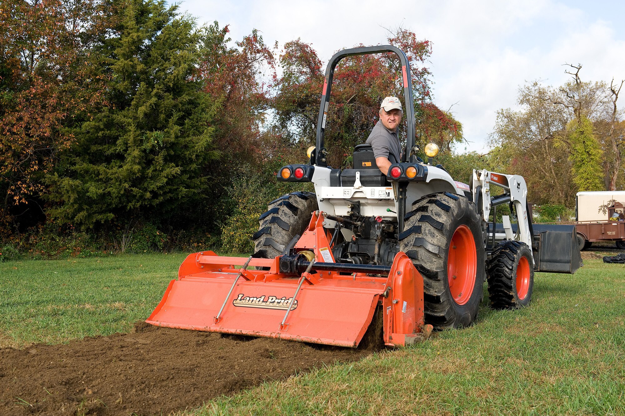 John Clendaniel, Delaware State University College of Agriculture and Related Sciences farm management specialist, tills soil Oct. 29, 2015, on Dover Air Force Base, Del. The new organic community garden located to the west of the Eagle Heights Housing Maintenance building, will be one single plot measuring 60-feet-wide by 120-feet-long and will be made handicap accessible as much as possible. (U.S. Air Force photo/Roland Balik)