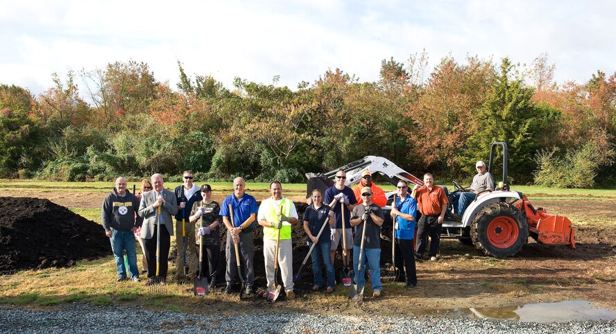 Team Dover Air Force Community Partnership Program P4 community garden initiative stakeholders and volunteers pose for a photo Oct. 29, 2015, on Dover Air Force Base, Del. The new community garden will allow Team Dover members, residents of Eagle Heights family housing, Dover AFB Youth Center patrons, students and teachers at George Welch Elementary School and Dover Air Force Base Middle School, the opportunity to learn and experience gardening by growing fresh organic vegetables under the guidance and educational instruction of gardening enthusiasts and educators from the local area. (U.S. Air Force photo/Roland Balik)
