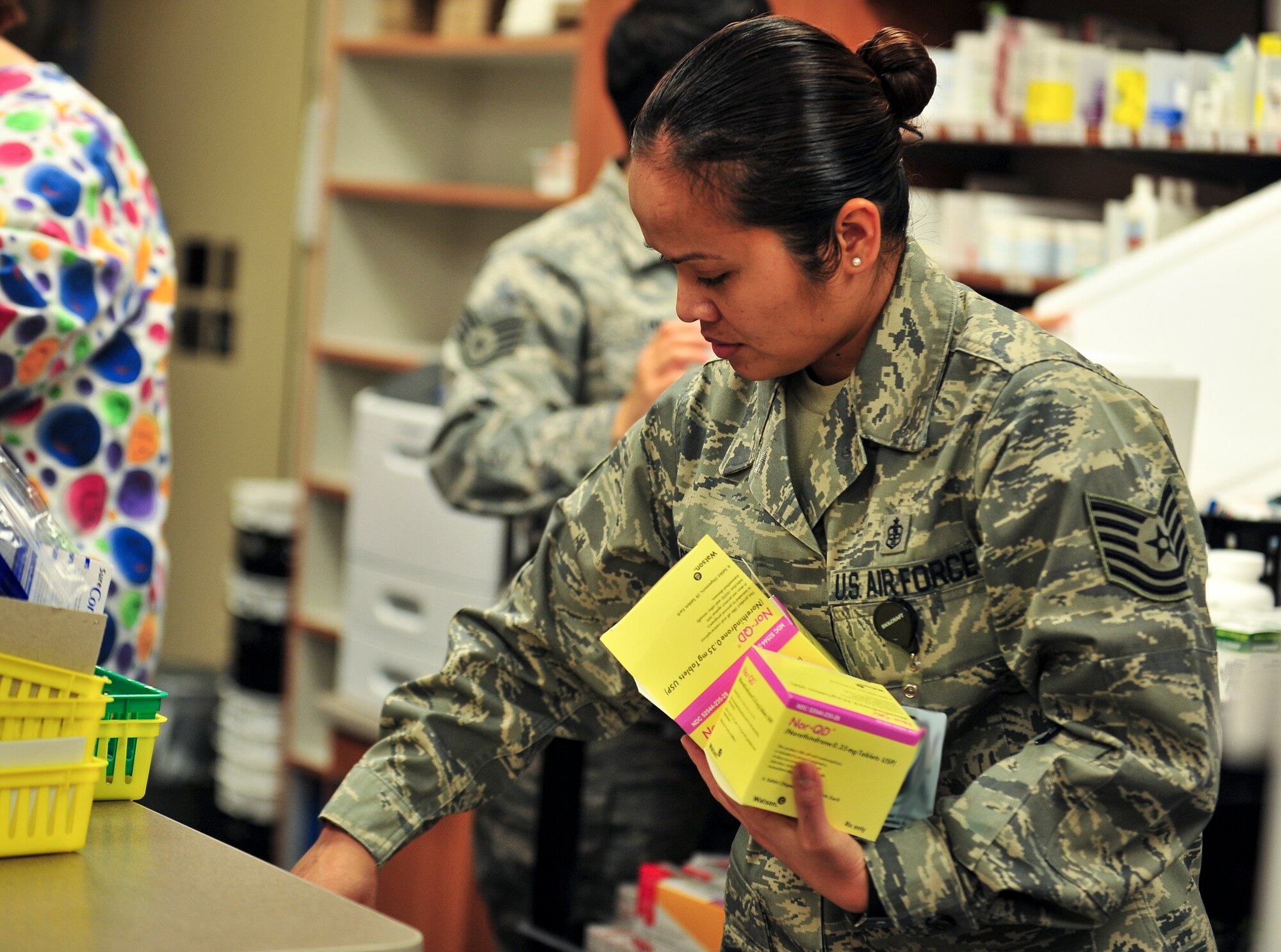 Tech. Sgt. Judith Berry, 5th Medical Support Squadron pharmacy NCO in charge, works to fill patient’s prescriptions at Minot Air Force Base, N.D., Oct. 26, 2015. Berry is one of five technicians and two pharmacy officers and serve 12,800 Tricare beneficiaries, including active duty service members and their dependents, as well as retirees and their dependents. (U.S. Air Force photo/Senior Airman Stephanie Morris)