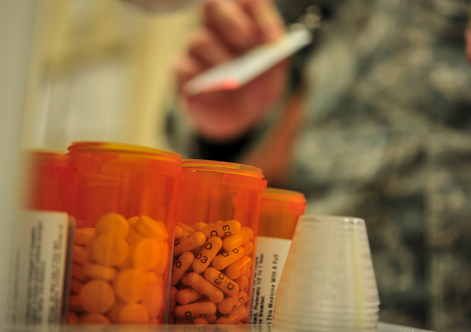 Airmen from the 5th Medical Group pharmacy work to fill patient’s prescriptions at Minot Air Force Base, N.D., Oct. 26, 2015. The pharmacy is open from 07:30 a.m. – 4:30 p.m., Monday-Friday, with the exception of monthly half-day training days, family days and most federal holidays. (U.S. Air Force photo/Senior Airman Stephanie Morris)