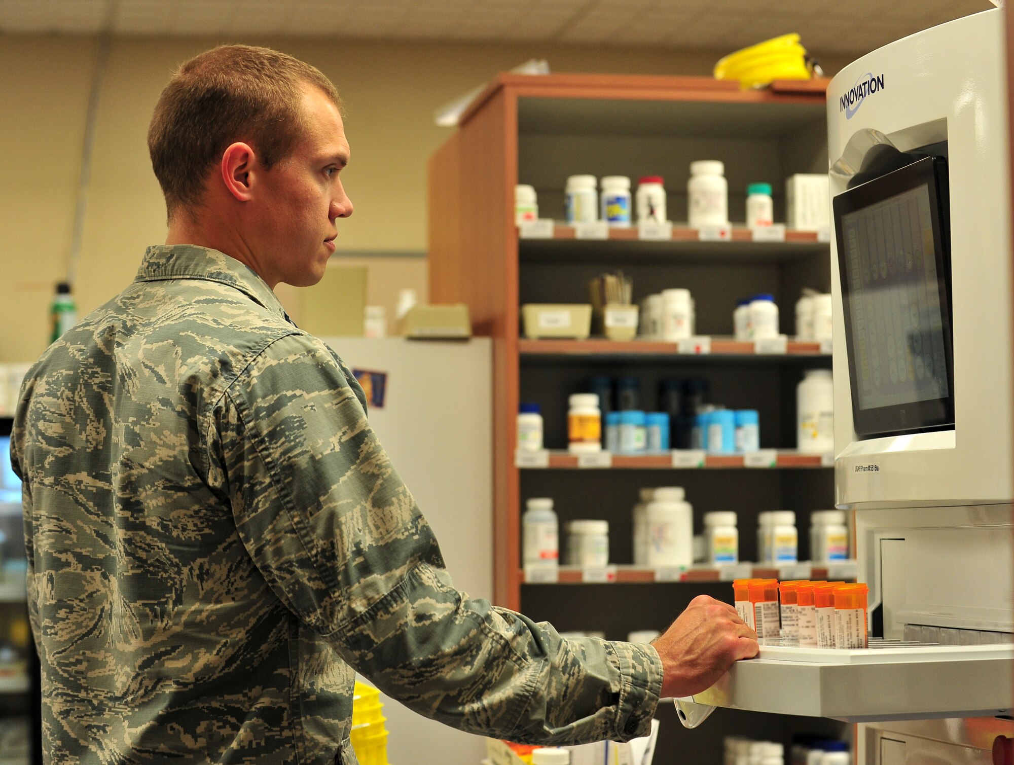 Capt. Brandon Hey, 5th Medical Support Squadron pharmacy element chief, works to fill patient’s prescriptions at Minot Air Force Base, N.D., Oct. 26, 2015. Hey and his fellow pharmacy personnel fill 85 thousand prescriptions annually and have an average wait time of about 15 minutes. (U.S. Air Force photo/Senior Airman Stephanie Morris)