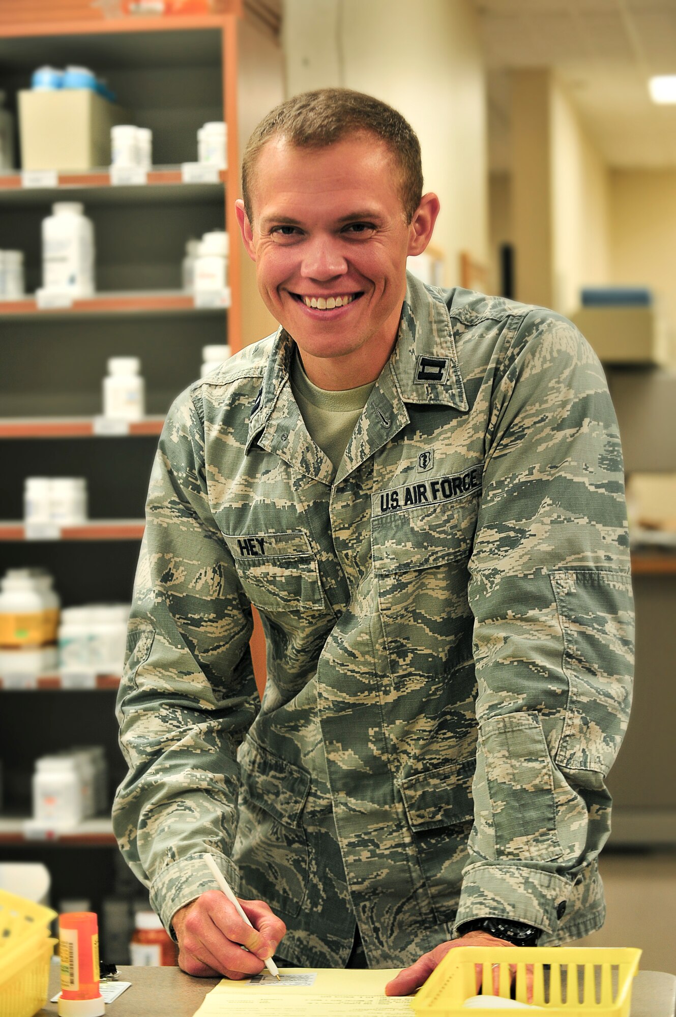 Capt. Brandon Hey, 5th Medical Support Squadron pharmacy element chief, works to fill patient’s prescriptions at Minot Air Force Base, N.D., Oct. 26, 2015. Hey and his fellow pharmacy personnel fill 85 thousand prescriptions annually and have an average wait time of about 15 minutes. (U.S. Air Force photo/Senior Airman Stephanie Morris)