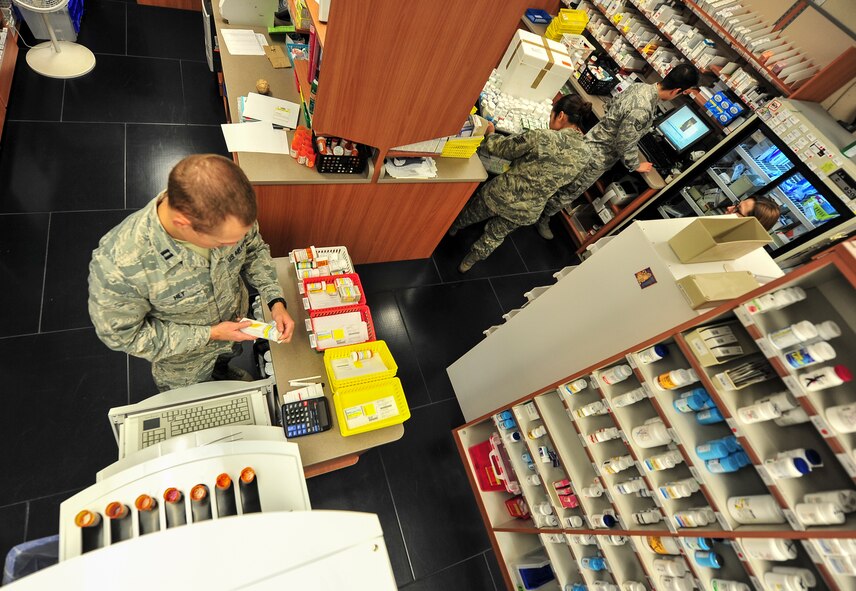 Capt. Brandon Hey, 5th Medical Support Squadron pharmacy element chief, works to fill patient’s prescriptions at Minot Air Force Base, N.D., Oct. 26, 2015. Hey and his fellow pharmacy personnel fill 85 thousand prescriptions annually and have an average wait time of about 15 minutes. (U.S. Air Force photo/Senior Airman Stephanie Morris)