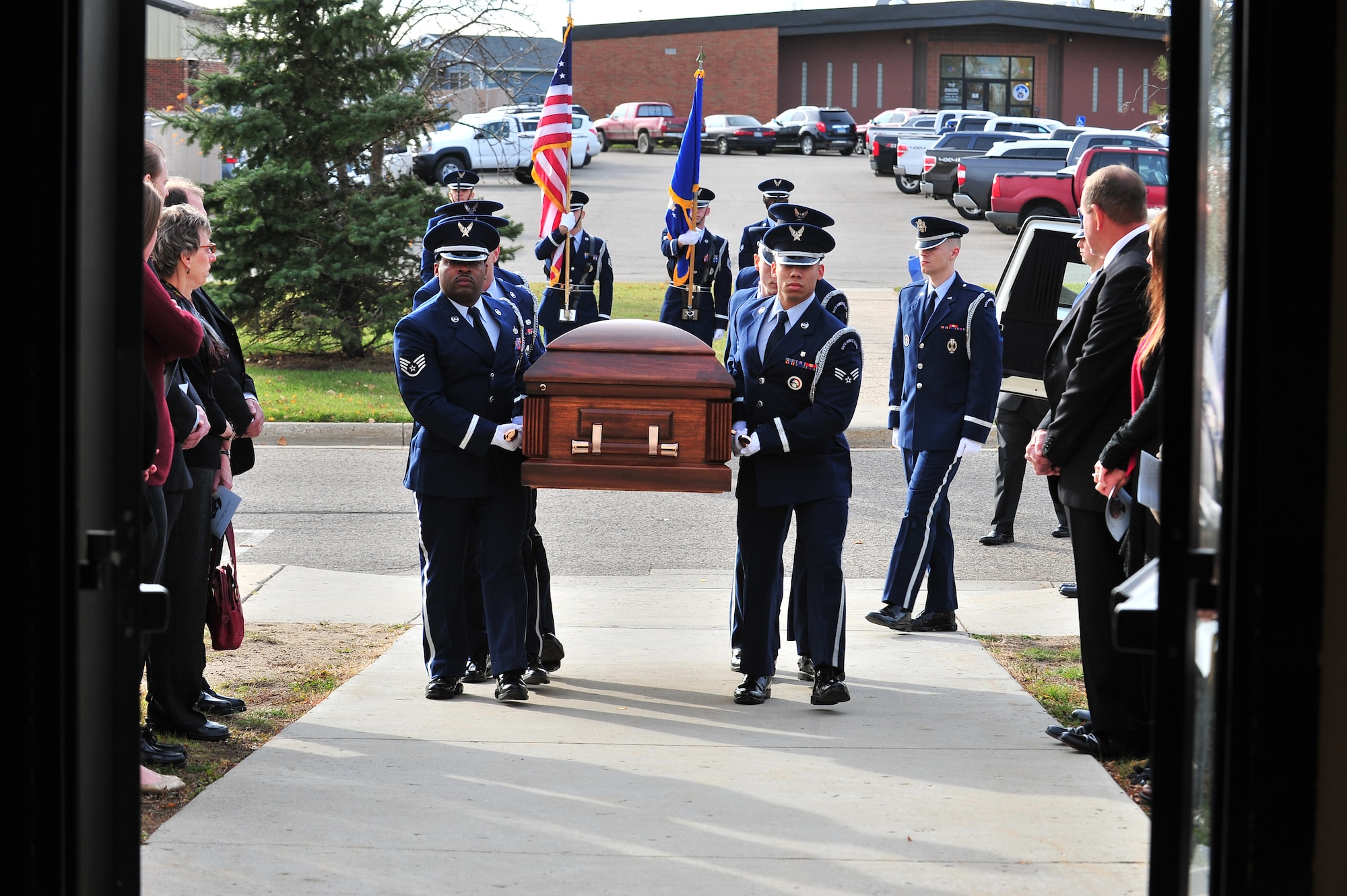 Honor guard members carry the casket of Master Sgt. Matthew Gonzalez during his funeral at Minot Air Force Base, N.D., Oct. 26, 2015. Gonzalez was born January 26, 1979, in Neenah, Wis. and enlisted in the Air Force in September 1997. (U.S. Air Force photo/Senior Airman Stephanie Morris)