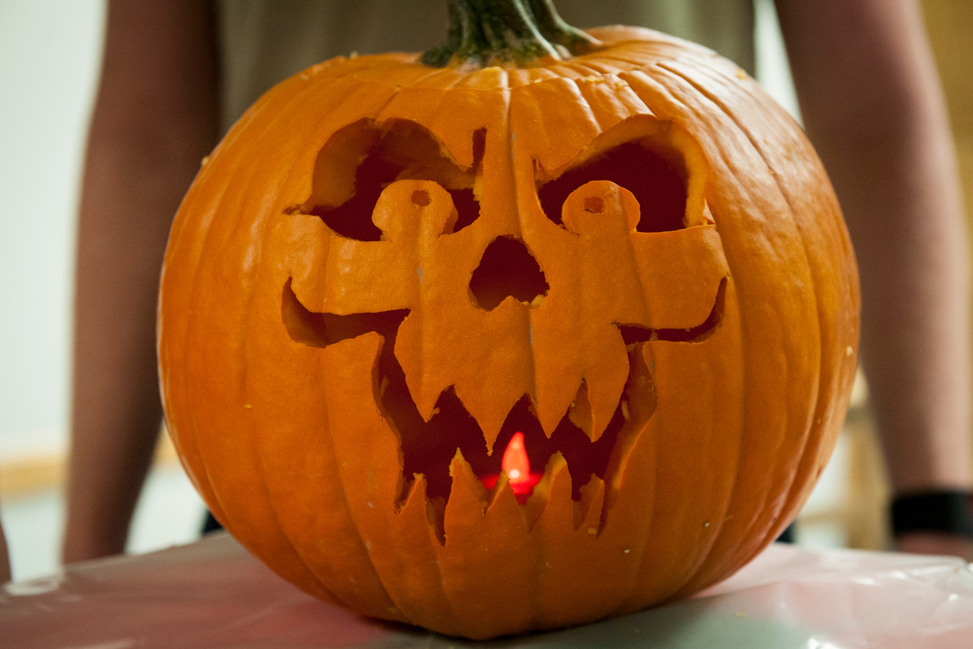 PETERSON AIR FORCE BASE, Colo. -- The winner of the Peterson Chapel's 3rd Annual Pumpkin Carving Contest impresses the judges at Patriot Hall, Oct. 28, 2015. The winners were Airmen 1st Class Sara Welch and Matthew Towles, both 21st Dental Squadron dental lab technicians. The event was to encourage fun and had 15 jack-o-lantern submissions. (U.S. Air Force photo by Senior Airman Rose Gudex)